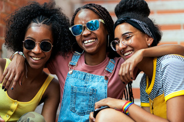 Three african Girl Friends. Three little friends hug each other