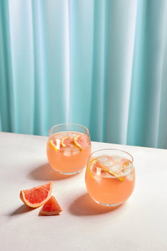 Fresh Grapefruit Cocktail Glasses On Table