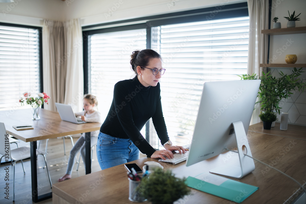 Wall mural Woman working indoors at home office, Corona virus and quarantine concept.