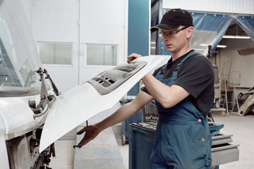 Man Working In Truck Auto Service
