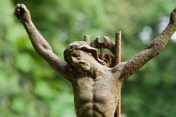Ancient iron statue of the crucifixion of Jesus Christ  of Nazareth