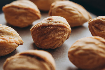 Homemade cookies with boiled condensed milk on a table background. Copy space