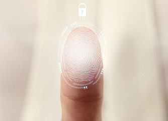 Woman using fingerprint protection for data access, closeup