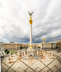 Independence square with monument and memorial billboards standing and cloudy dramatic sky in the background. Kyiv. Ukraine. 07.10.2019