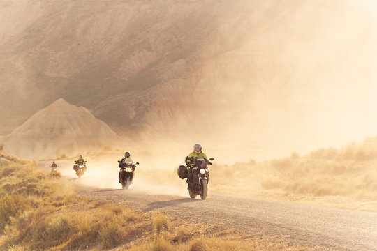 People Riding Motorcycle in the desert