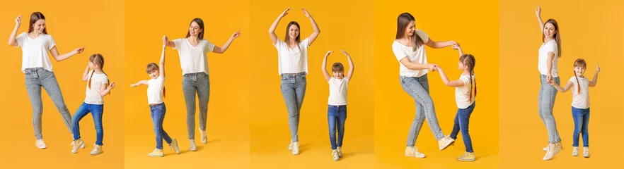 Gordijnen Happy mother and her little daughter dancing against color background © Pixel-Shot