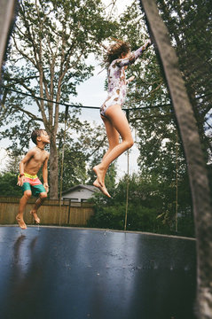 Summer fun on the trampoline with sprinklers