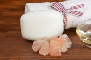 natural bath salt, white soap, towel and body oil