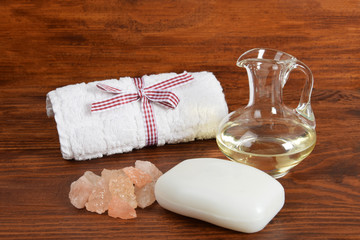 white soap, towel and body oil