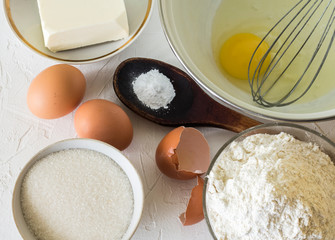 Ingredients eggs with butter and flour for short pastry, for baking pie flat layout