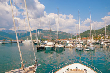 Fototapeta na wymiar Yacht marina. View of marina of Porto Montenegro on sunny summer day. Montenegro, Adriatic Sea, Bay of Kotor, Tivat city
