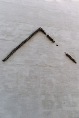 bricks on a housewall in shape of a regular roof