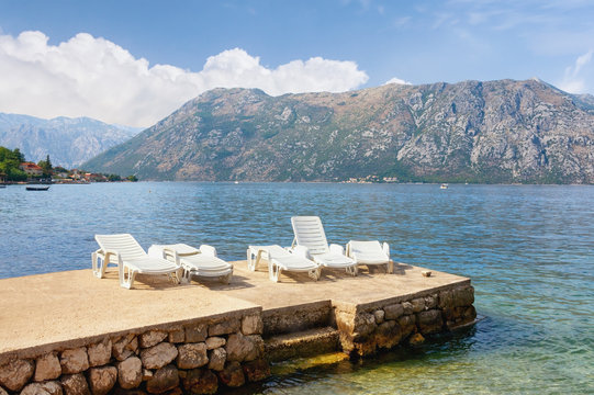 Beautiful Mediterranean landscape. Sunny autumn day.  Montenegro, Adriatic Sea, view of Bay of Kotor near Prcanj town