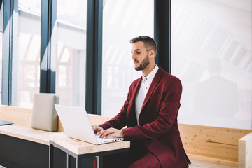 Businessman working with laptop in workspace