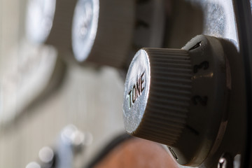 Tone potentiometer on an electric guitar in macro