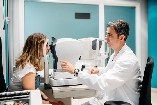 Oculist checking patient's eyes pressure, tonometry