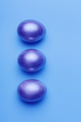 Neon easter eggs on a blue background.