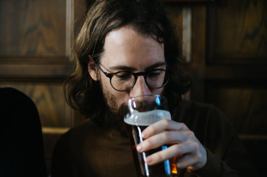 Man drinking a pint of beer