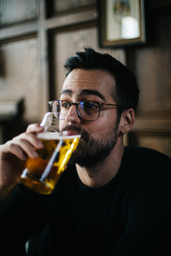 Man Drinking A Beer