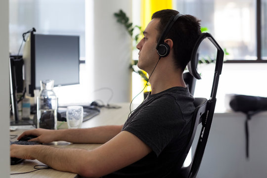 Young male developer working in the office