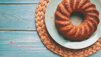 Lemon cake on a blue wooden background.