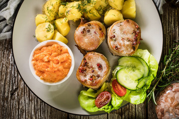 Pork tenderloin wrapped in bacon.