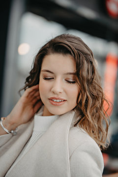 Beautiful young brunette girl close portrait looking in camera