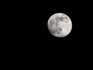 Full moon on black sky background