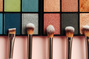 Make-up palette and brushes. Professional eyeshadow palette. Close up. - obrazy, fototapety, plakaty