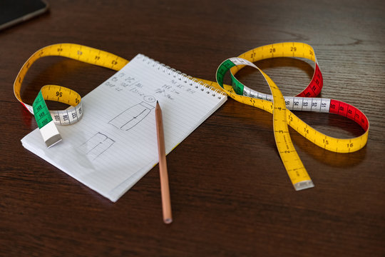 Notepad with pattern and measuring tape