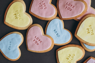 Valentine's Day presents: Heart-shaped cookies with colorful glaze and themed lettering for all...