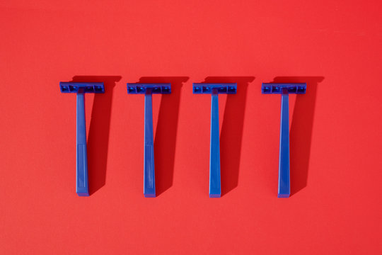 Blue Disposable Razors on Red