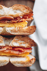 cut in half a bagel which is full of delicious juicy stuffing. Appetizing breakfast close up