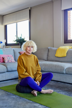 Senior woman sitting on a meditation cushion