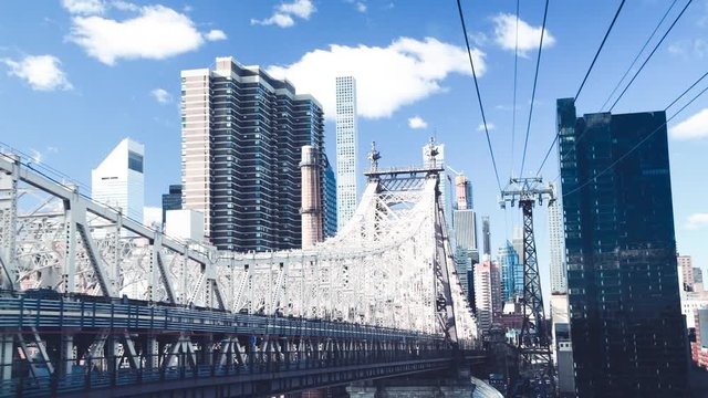Aerial view of Queensboro Bridge and Midtown Manhattan buildings, New York City in slow motion