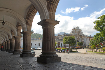 Obraz premium Guatemala - Antigua central square - old historic village with arcade and church
