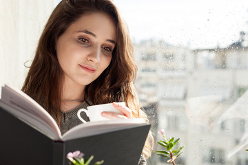 young woman reading a book