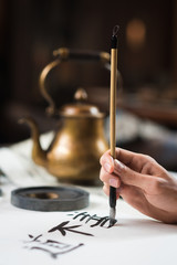 Fototapeta na wymiar brush for traditional chinese calligraphy in hand