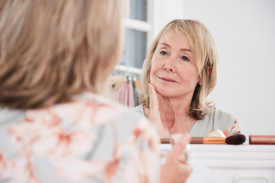 Gorgeous mature woman hydrating