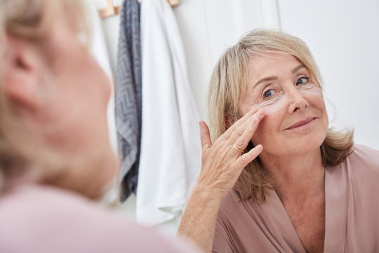 Mature woman under eye care