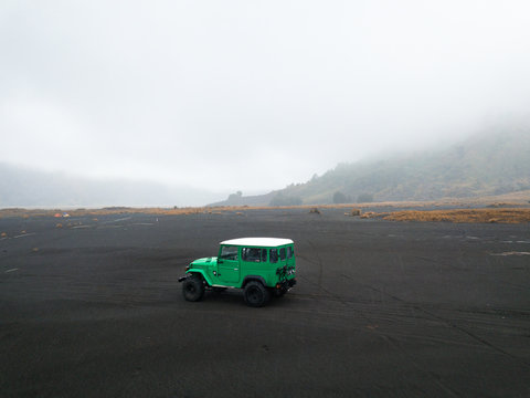 Aerial view of an all-terrain car on Mount Bromo, East Java, Indonesia.