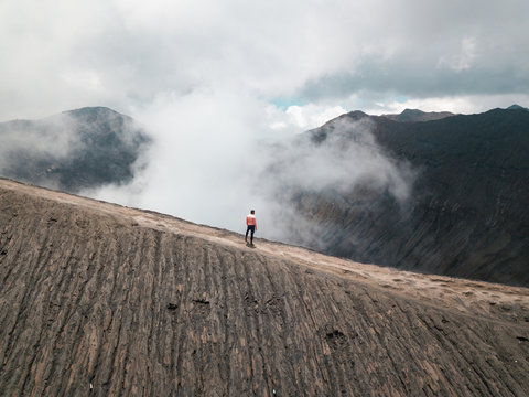 Aerial view of a man watching Mount Bromo, East Java, Indonesia.
