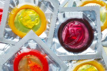 colorful condoms background, safe sex concept