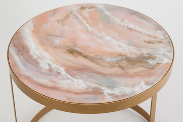 a table with a golden tabletop and a beautiful agate counter top