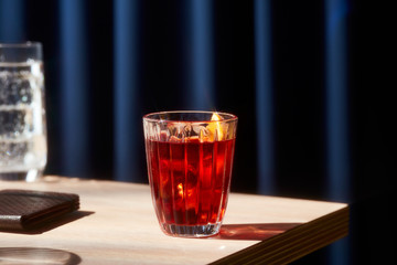 Negroni cocktail photographed with a star filter