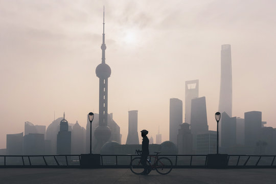 Man with a bike in The Bund, Shanghai