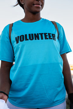 Anonymous Volunteer Wearing Blue T Shirt