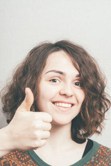 woman showing thumbs up