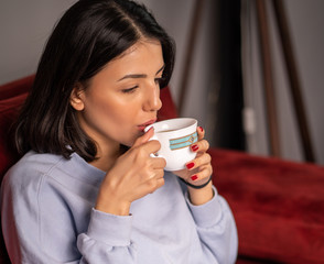 close up woman drinking tea