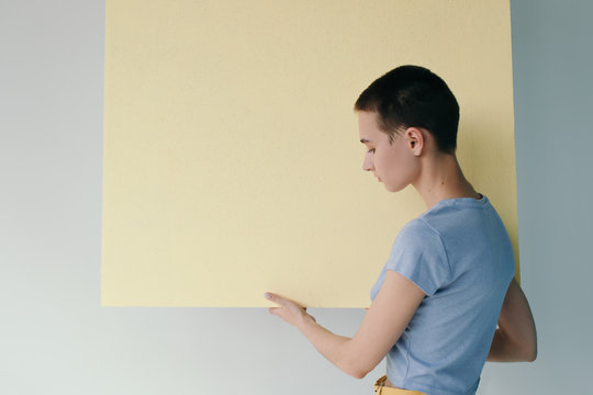 Young woman carrying empty banner